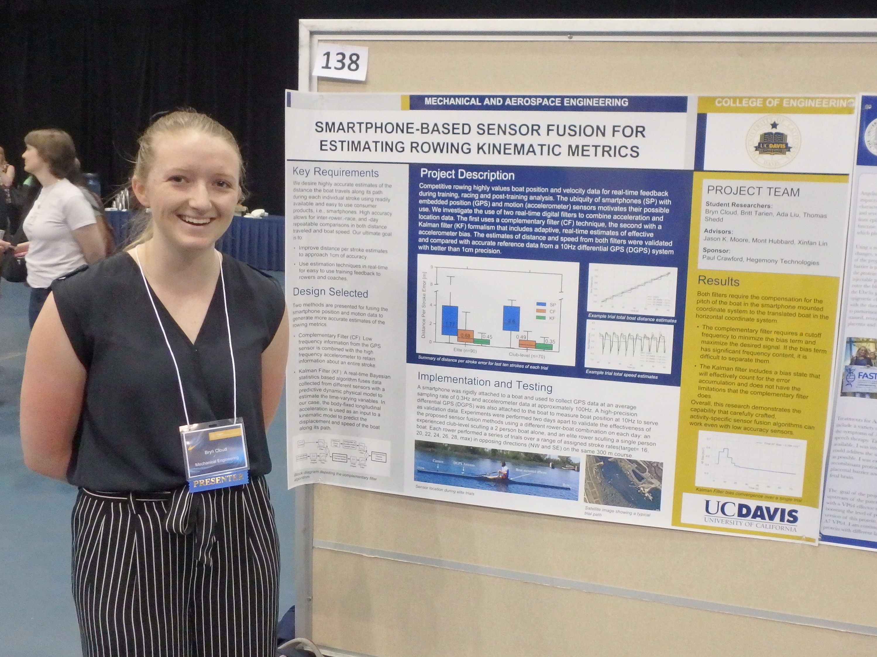 Bryn Cloud standing beside her poster at the conference.